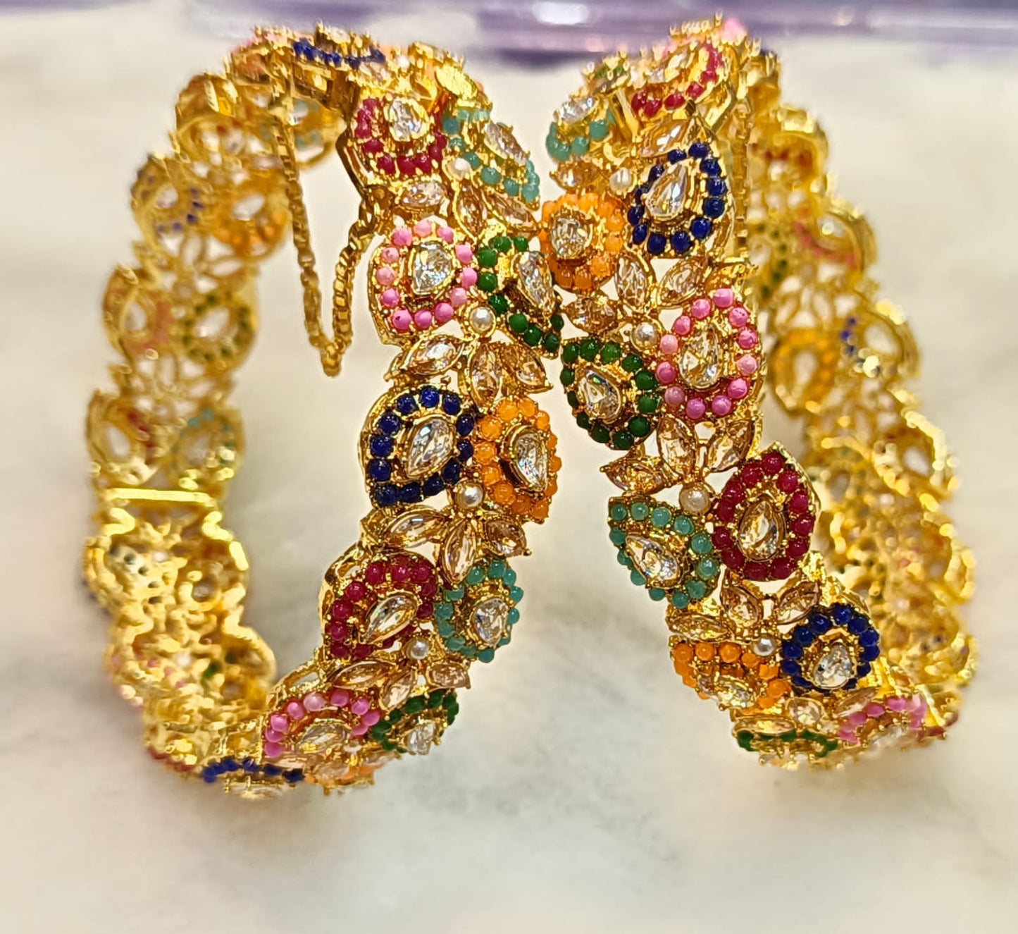 Artificial Open Bangles Through the Ages: History and Evolution