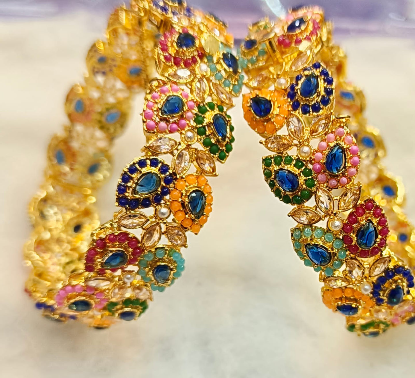 Artificial Open Bangles Through the Ages: History and Evolution