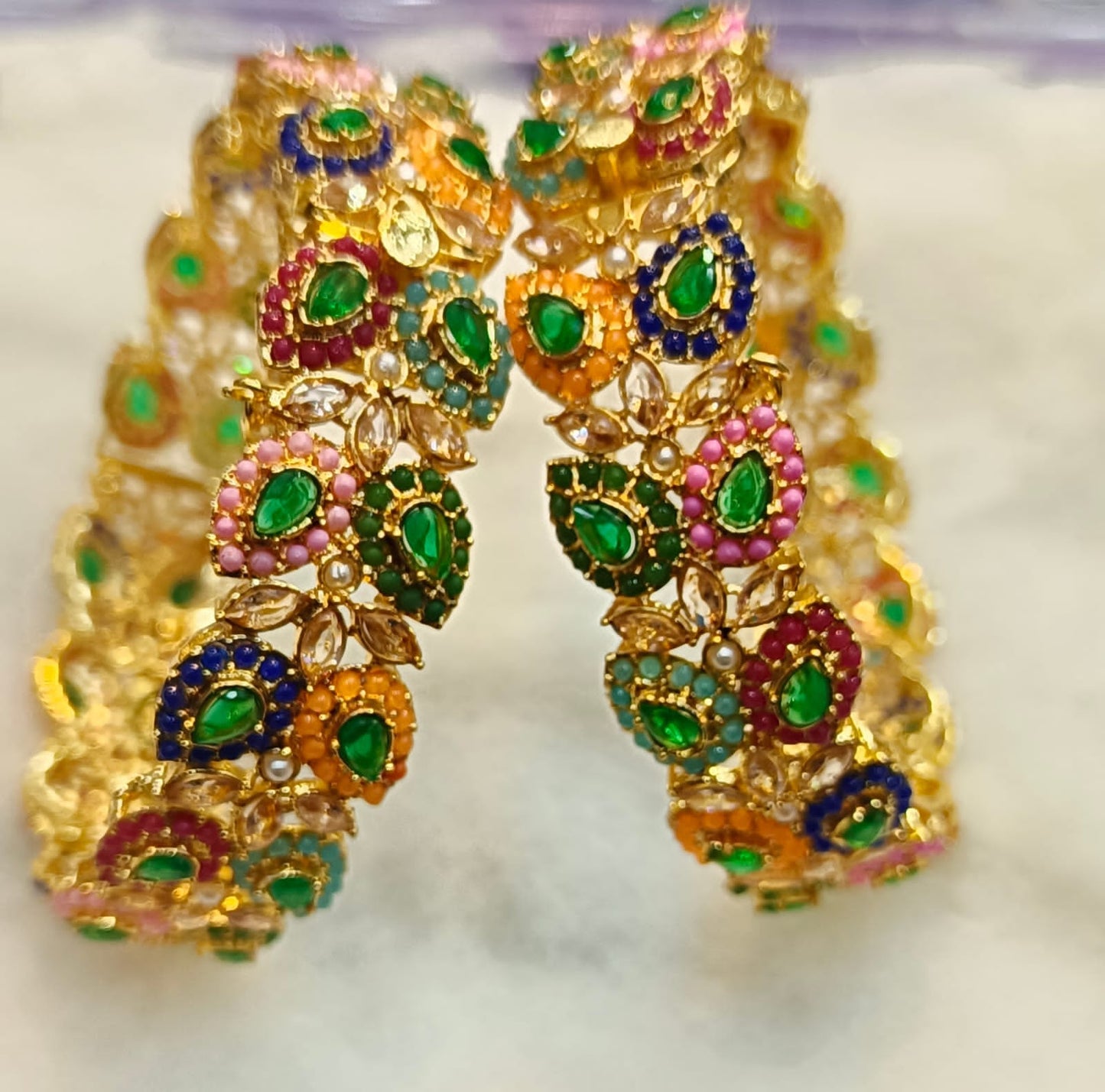 Artificial Open Bangles Through the Ages: History and Evolution