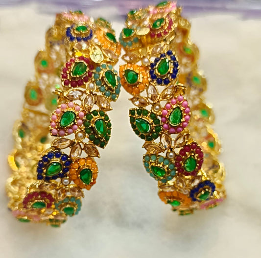 Artificial Open Bangles Through the Ages: History and Evolution