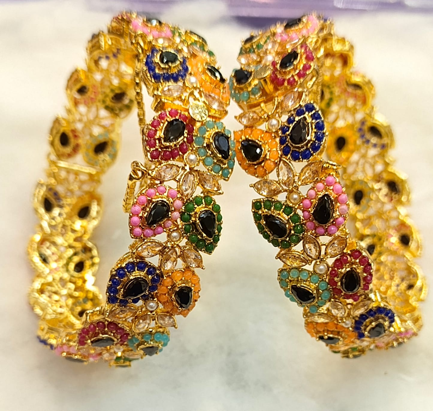 Artificial Open Bangles Through the Ages: History and Evolution