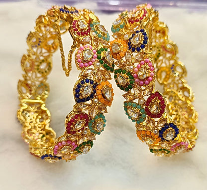 Artificial Open Bangles Through the Ages: History and Evolution