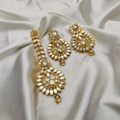 Light weight earrings and teeka set with sheesha stones and pearl drops.