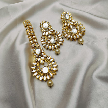 Light weight earrings and teeka set with sheesha stones and pearl drops.